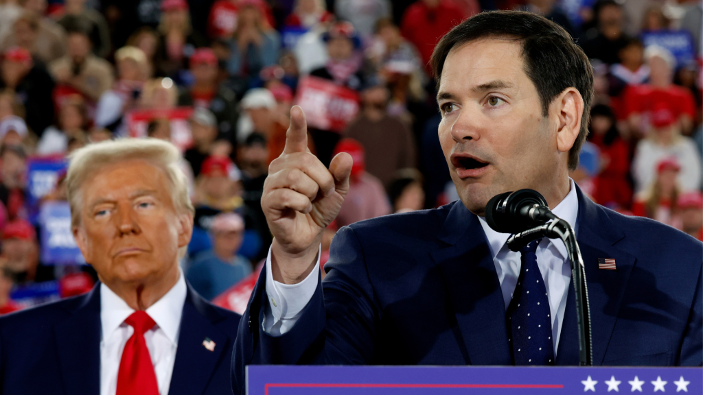 Donald Trump watches as U.S. Sen. Marco Rubio (R-FL) speaks during a campaign rally. Photo: Getty Images