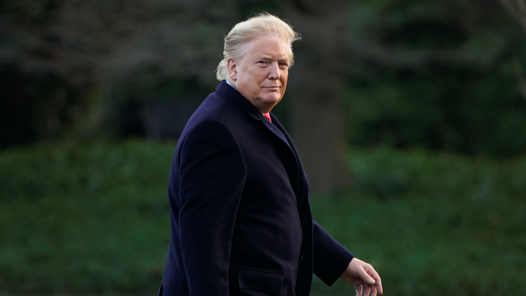 Donald Trump walks to the Oval Office.