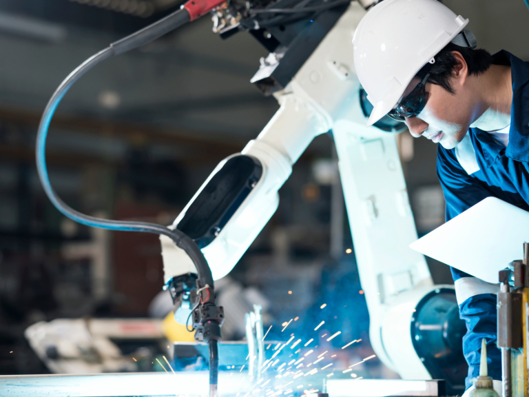 Male Mechanical Engineers working on a laptop for checking the accuracy testing, data analysis, and modeling techniques of welding processes based on welding quality evaluation.