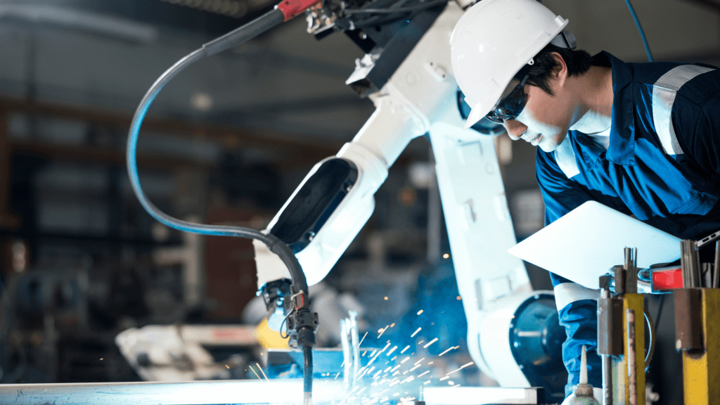 Male Mechanical Engineers working on a laptop for checking the accuracy testing, data analysis, and modeling techniques of welding processes based on welding quality evaluation.